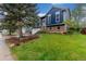 Inviting two-story home with well-kept lawn and gardens, showcasing curb appeal and neighborhood charm at 10370 Routt St, Westminster, CO 80021