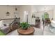 Open-concept living space with modern decor, stylish furnishings, and seamless flow to dining area at 10370 Routt St, Westminster, CO 80021