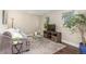 Cozy living room features a comfortable sofa, modern entertainment center, and bright natural light at 10370 Routt St, Westminster, CO 80021