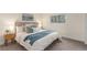 Comfortable main bedroom features a plush bed, side tables, and carpeted floors at 10370 Routt St, Westminster, CO 80021