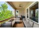 Outdoor back porch with comfortable seating and pleasant views of the surrounding landscape at 15779 W 83Rd Pl, Arvada, CO 80007