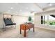 Large basement area including foosball and a pool table providing many entertainment options at 15779 W 83Rd Pl, Arvada, CO 80007