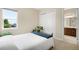 Bedroom featuring a bed, a closet, and natural light from the window at 15779 W 83Rd Pl, Arvada, CO 80007