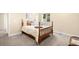 Inviting bedroom with warm neutral paint, carpet, and a bright window at 15779 W 83Rd Pl, Arvada, CO 80007