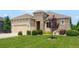 Charming one-story home with a manicured lawn, stone accents, and a two-car garage at 15779 W 83Rd Pl, Arvada, CO 80007