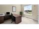 Bright home office with a large window offering a pleasant view of the neighborhood at 15779 W 83Rd Pl, Arvada, CO 80007