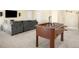 Spacious recreation room featuring a foosball table and comfortable seating area at 15779 W 83Rd Pl, Arvada, CO 80007