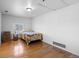Cozy bedroom with hardwood floors, and natural light from the window at 4849 N Cook St, Denver, CO 80216