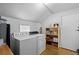 Laundry room featuring washer, dryer, shelves, and storage space at 4849 N Cook St, Denver, CO 80216