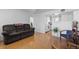 Spacious living room featuring wood floors and a pass-through to the kitchen at 4849 N Cook St, Denver, CO 80216