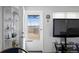 Bright living area showcasing a glass storm door and modern decor at 4849 N Cook St, Denver, CO 80216