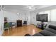 Comfortable living room with warm wood floors and abundant natural light at 4849 N Cook St, Denver, CO 80216