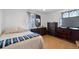 Relaxing main bedroom with wood floors and traditional furniture at 4849 N Cook St, Denver, CO 80216