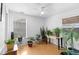 Sunlit office space with hardwood floors and multiple plants creating a tranquil atmosphere at 4849 N Cook St, Denver, CO 80216
