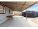 Covered patio ideal for outdoor entertaining, with space for seating and dining at 4849 N Cook St, Denver, CO 80216