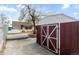 Backyard featuring a shed and pathway to the main house and greenhouse at 4849 N Cook St, Denver, CO 80216