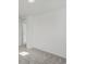 Bedroom has an open door with plush carpeting and neutral walls ready to personalize at 2042 S Holly St # 3, Denver, CO 80222