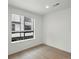 Bright room with a large window featuring modern blinds and natural light, making it perfect for rest and relaxation at 2042 S Holly St # 3, Denver, CO 80222