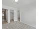 Bright primary bedroom showcasing adjacent bathroom and a closet at 2042 S Holly St # 3, Denver, CO 80222