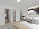 Serene bedroom features stylish decor, an ensuite bathroom, and a spacious closet at 2042 S Holly St # 3, Denver, CO 80222
