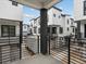 Balcony view of modern townhomes with black trim and gravel landscaping at 2042 S Holly St # 3, Denver, CO 80222
