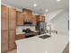 Spacious open kitchen features a large island with a sink and modern appliances, perfect for cooking and entertaining at 2042 S Holly St # 3, Denver, CO 80222