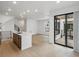 Bright open-concept kitchen with lots of natural light and balcony access; perfect for entertaining at 2042 S Holly St # 3, Denver, CO 80222