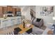 Cozy living room featuring modern furnishings, an open staircase and neutral tones, creating an inviting atmosphere at 2042 S Holly St # 3, Denver, CO 80222