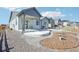 Outdoor living is a dream with this home's private backyard, featuring a patio and landscaped yard at 1702 Metcalf Dr, Erie, CO 80516