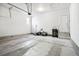 Clean and well-lit two car garage with sealed cement floor at 1702 Metcalf Dr, Erie, CO 80516