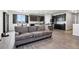 Comfortable living space flows into the kitchen, creating a seamless and inviting atmosphere perfect for entertaining at 1702 Metcalf Dr, Erie, CO 80516