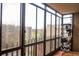 Enclosed balcony with floor to ceiling windows and view of surrounding buildings and greenery at 14091 E Marina Dr # 612, Aurora, CO 80014