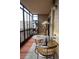 Comfortable enclosed balcony space with seating area and room to relax at 14091 E Marina Dr # 612, Aurora, CO 80014