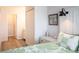 Tastefully decorated bedroom with a comfortable bed, side table, and closet space at 14091 E Marina Dr # 612, Aurora, CO 80014