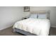 Bedroom featuring comfortable bed, side table, and natural light at 14091 E Marina Dr # 612, Aurora, CO 80014