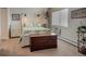 Bright bedroom with a plush bed, charming decor, and natural light from the window at 14091 E Marina Dr # 612, Aurora, CO 80014