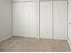 Spacious bedroom closet area with multiple doors, providing ample storage at 14091 E Marina Dr # 612, Aurora, CO 80014