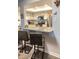 Modern kitchen features granite countertops, stainless steel appliances, and a breakfast bar with seating for two at 14091 E Marina Dr # 612, Aurora, CO 80014