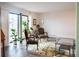 Bright living room with large windows, stylish decor, and access to outdoor balcony at 14091 E Marina Dr # 612, Aurora, CO 80014