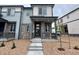 Inviting two-story home with stone accents, covered porch, and well-maintained landscaping at 6678 N Nepal Ct, Aurora, CO 80019