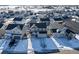 Aerial view of house and neighborhood in snowy setting at 39260 Braxton Ln, Elizabeth, CO 80107