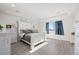Bright bedroom with a large bed, dresser, and window at 39260 Braxton Ln, Elizabeth, CO 80107