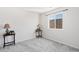 Small bedroom with a window and side table at 39260 Braxton Ln, Elizabeth, CO 80107