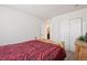 Bedroom with wooden bed frame and access to bathroom at 39260 Braxton Ln, Elizabeth, CO 80107