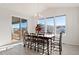 Bright dining room with sliding glass doors leading to a deck at 39260 Braxton Ln, Elizabeth, CO 80107