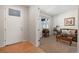 Bright entryway with wood floors and a view into a cozy sitting area at 39260 Braxton Ln, Elizabeth, CO 80107