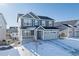 Two-story house with gray siding, stone accents, and a two-car garage at 39260 Braxton Ln, Elizabeth, CO 80107