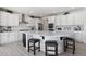 Spacious kitchen with island, stainless steel appliances, and white cabinets at 39260 Braxton Ln, Elizabeth, CO 80107