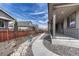 The backyard features a rock pathway and a covered porch at 7646 Greenwater Cir, Castle Rock, CO 80108