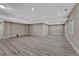 Unfurnished basement is ready for customization and features durable wood-look flooring, offering versatile living space at 7646 Greenwater Cir, Castle Rock, CO 80108